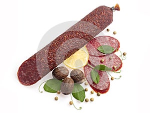 Smoked salami decorated with lemon, walnuts...