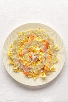 Smoked salmon with bowtie pasta. Farfalle with salmon and a cream sauce, shot from above