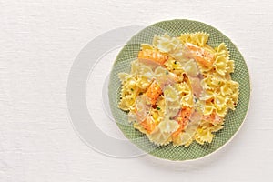 Smoked salmon with bowtie pasta. A plate of farfalle with salmon and a cream sauce