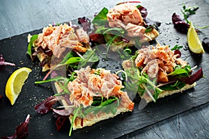 Smoked salmon flakes on salad bed and irish potato slims snacks, appetizers