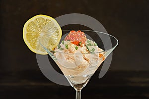 Smoked salmon mousse with red caviar in martini glass. French gourmet cuisine
