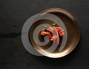 Smoked salmon slices decorated on a plate