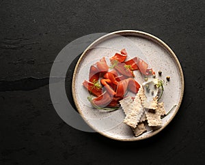 Smoked salmon slices decorated on a plate