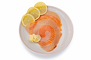 Smoked salmon slices with lemon slices