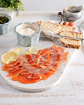 Smoked salmon slices on marble board. Salmon for toasts.