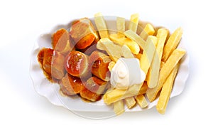 Smoked sausage and golden French fries photo