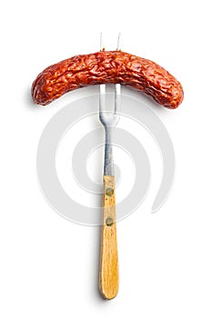 Smoked sausage pricked on a fork