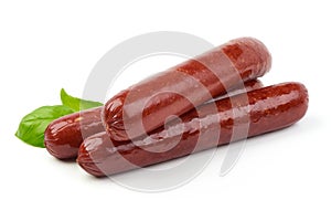Smoked sausages with fresh herbs, isolated on white background