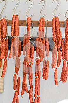 Smoked sausages, meats in butcher's shop. photo