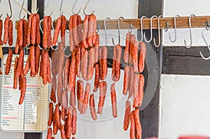 Smoked sausages, meats in butcher's shop. photo