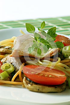 Smoked trout with colored spaghetti and vegetable