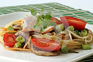 Smoked trout with colored spaghetti and vegetable