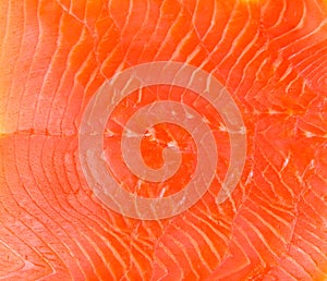 Smoked trout fillet slices as background