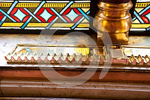 Smokers lounge: Old shelf for storing already lighted cigars in numbered slots and an ashtray