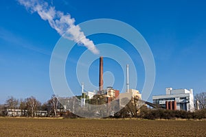 Smokestack against blue sky