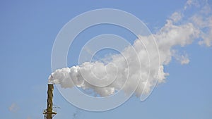 Smokestack in Blue Sky from Factory in Reverse Motion