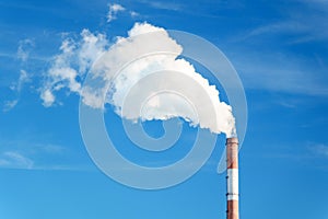 Smokestack emits thick creating a striking visual image of industrial pollution.