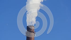 Smokestack emits white smoke time lapse