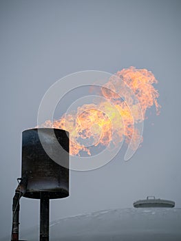Smokestack with flames.