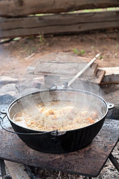 Smoking cauldron with pilaff cooking. Vertical image, series photo