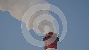 Smoking chimney of a coal power plant. Air pollution.