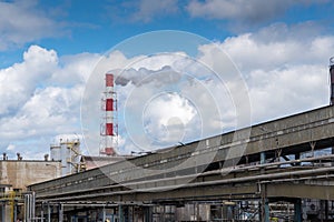 Smoking chimney in factory. Industry, climate and ecology concept.