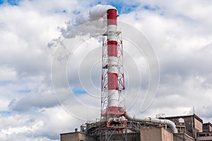 Smoking chimney in factory. Industry, climate and ecology concept.