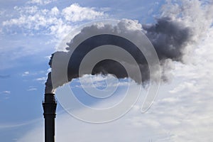 Smoking chimney producing greenhouse gasses