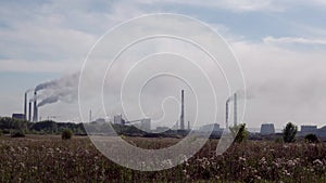 Smoking chimneys of a large factory