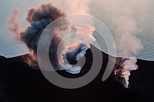 Smoking erupting volcano on Stromboli island, Sicily photo