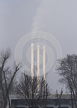 Smoking factory chimney or smokestack