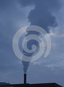 Smoking factory chimney or smokestack