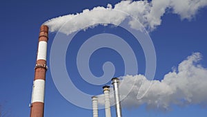 Smoking factory chimneys. Environmental problem of pollution of environment and air in large cities.