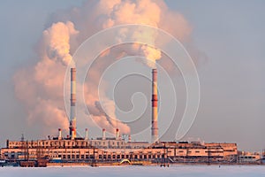 Smoking factory chimneys. Environmental problem of pollution of environment and air in large cities