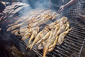 Smoking fish on a grill using charcoal