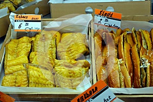 Smoking fish pieces. Cold smoked for sale in the fish market