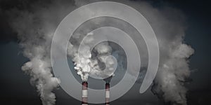 Smoking industrial chimneys in dark clouds. Concept for environmental protection