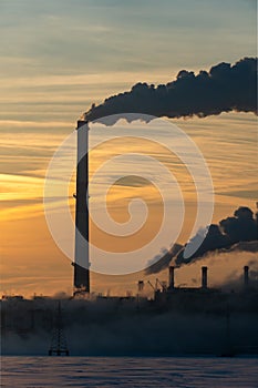 Smoking industrial zone factory chimneys. View of large plant with Smoking pipes