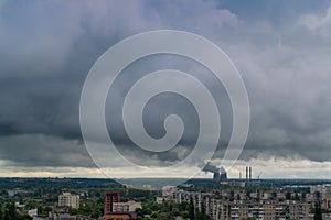 Smoking pipes of thermal power plant against blue