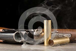 Smoking rifle and brass shells