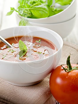Smoking tomato soup with basil