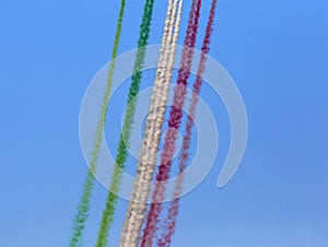 The smoking trails in the sky performed by engines of italian tricolor arrows team