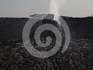 Smoking volcanic pinnacle close to Erta Ale volcano, Ethiopia