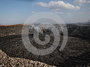 Smoking volcanic pinnacle close to Erta Ale volcano, Ethiopia