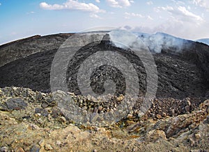 Smoking volcanic pinnacle close to Erta Ale volcano, Ethiopia
