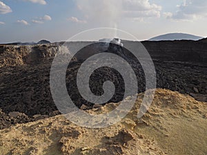 Smoking volcanic pinnacle close to Erta Ale volcano, Ethiopia