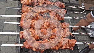 Smoky grilling the marinated pork meat shashlik. Barbecue fried on grill. summer picnic