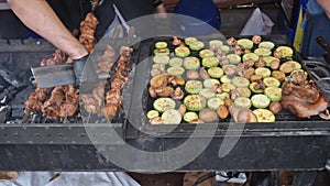 Smoky grilling the marinated pork meat shashlik. Barbecue fried on grill. summer picnic. Grilled zucchini