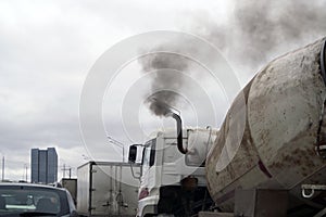 Smoky truck in a traffic jam