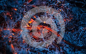 Smoldering ashes in the fire